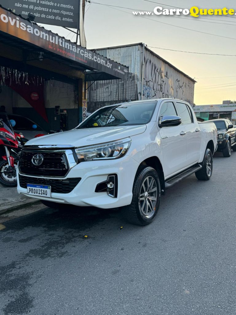 TOYOTA   HILUX CD SRX 4X4 2.8 TDI 16V DIESEL AUT.   BRANCO 2019 2.8 DIESEL - Loja