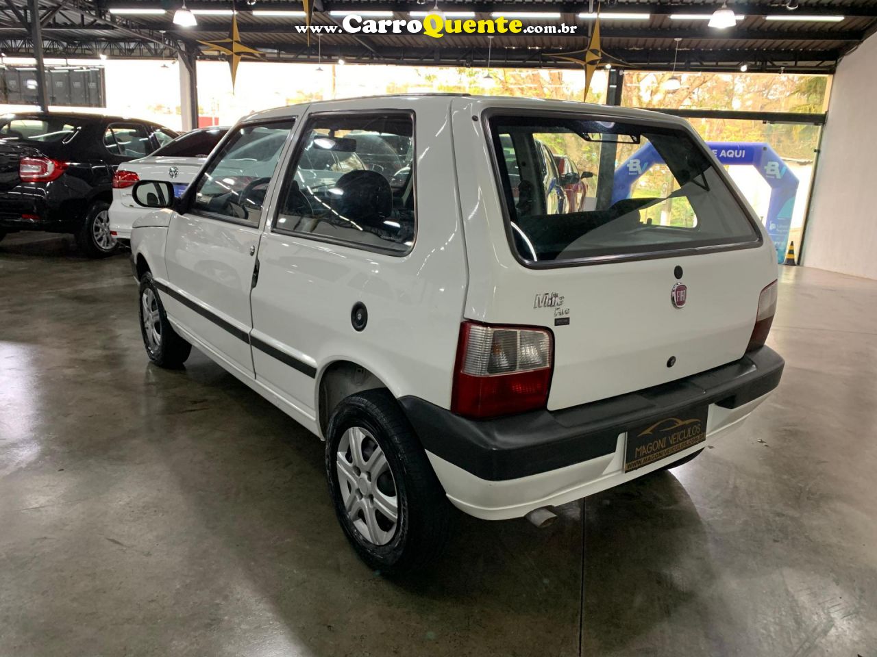 FIAT   UNO MILLE WAY ECONOMY 1.0 F.FLEX 4P   BRANCO 2013 1.0 GASOLINA - Loja