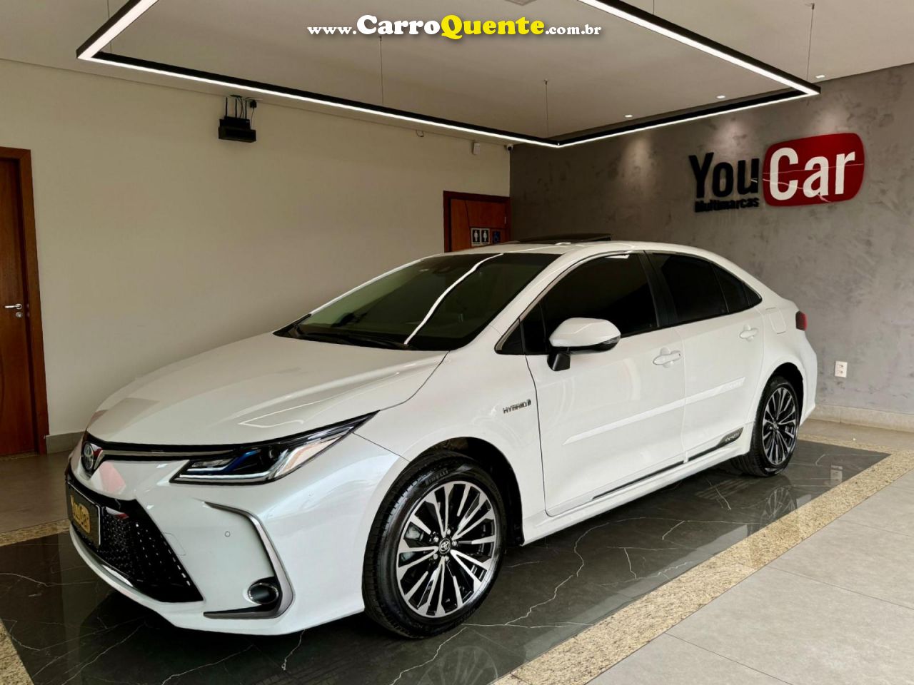 TOYOTA   COROLLA ALTIS PREM. 1.8 AUT. (HÍBRIDO)   BRANCO 2024 1.8 GASOLINA E ELÉTRICO - Loja