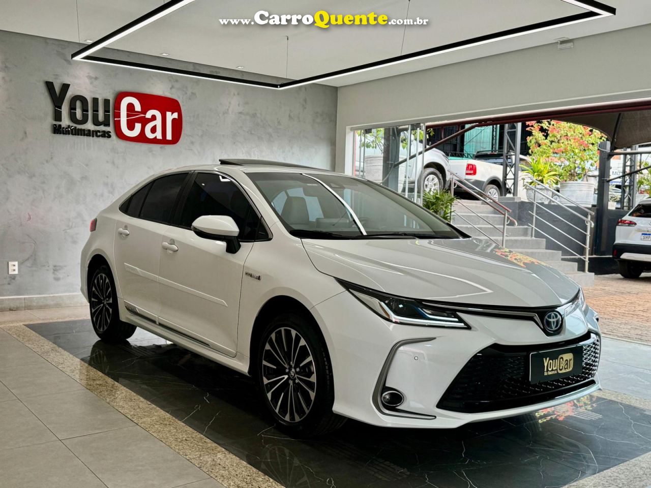 TOYOTA   COROLLA ALTIS PREM. 1.8 AUT. (HÍBRIDO)   BRANCO 2024 1.8 GASOLINA E ELÉTRICO - Loja