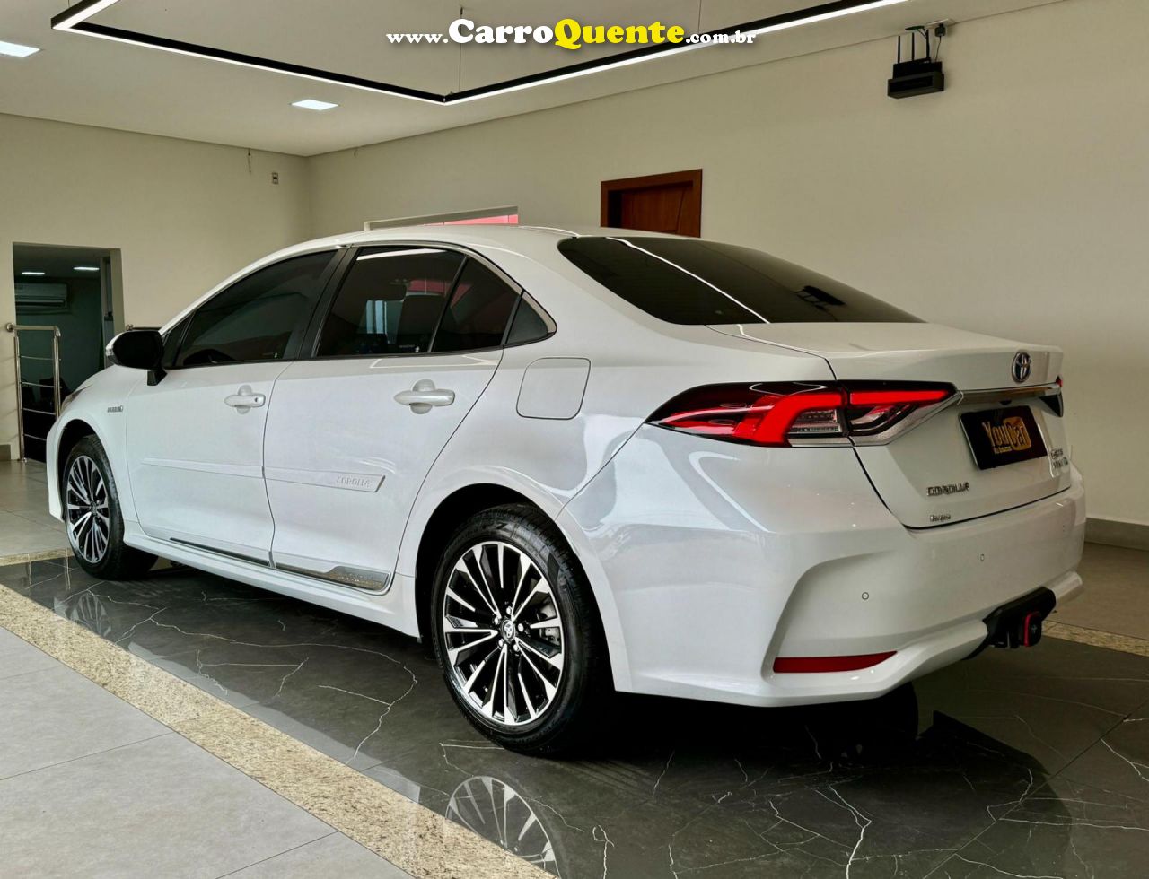 TOYOTA   COROLLA ALTIS PREM. 1.8 AUT. (HÍBRIDO)   BRANCO 2024 1.8 GASOLINA E ELÉTRICO - Loja