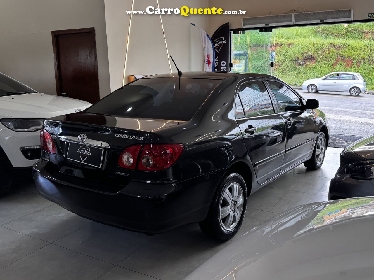 TOYOTA   COROLLA SE-G 1.81.8 FLEX 16V AUT.   PRETO 2006 1.8 GASOLINA - Loja