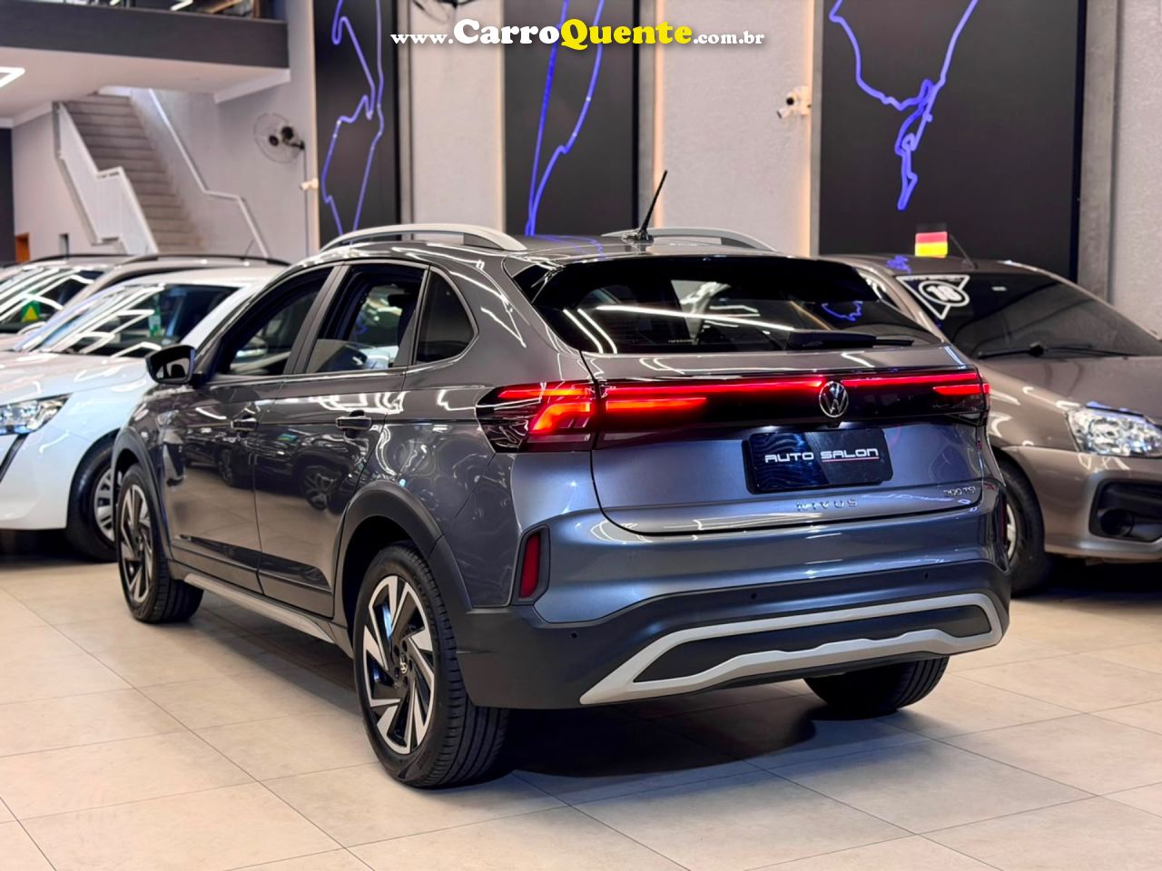 VOLKSWAGEN NIVUS 1.0 200 TSI TOTAL HIGHLINE 2025 - Loja