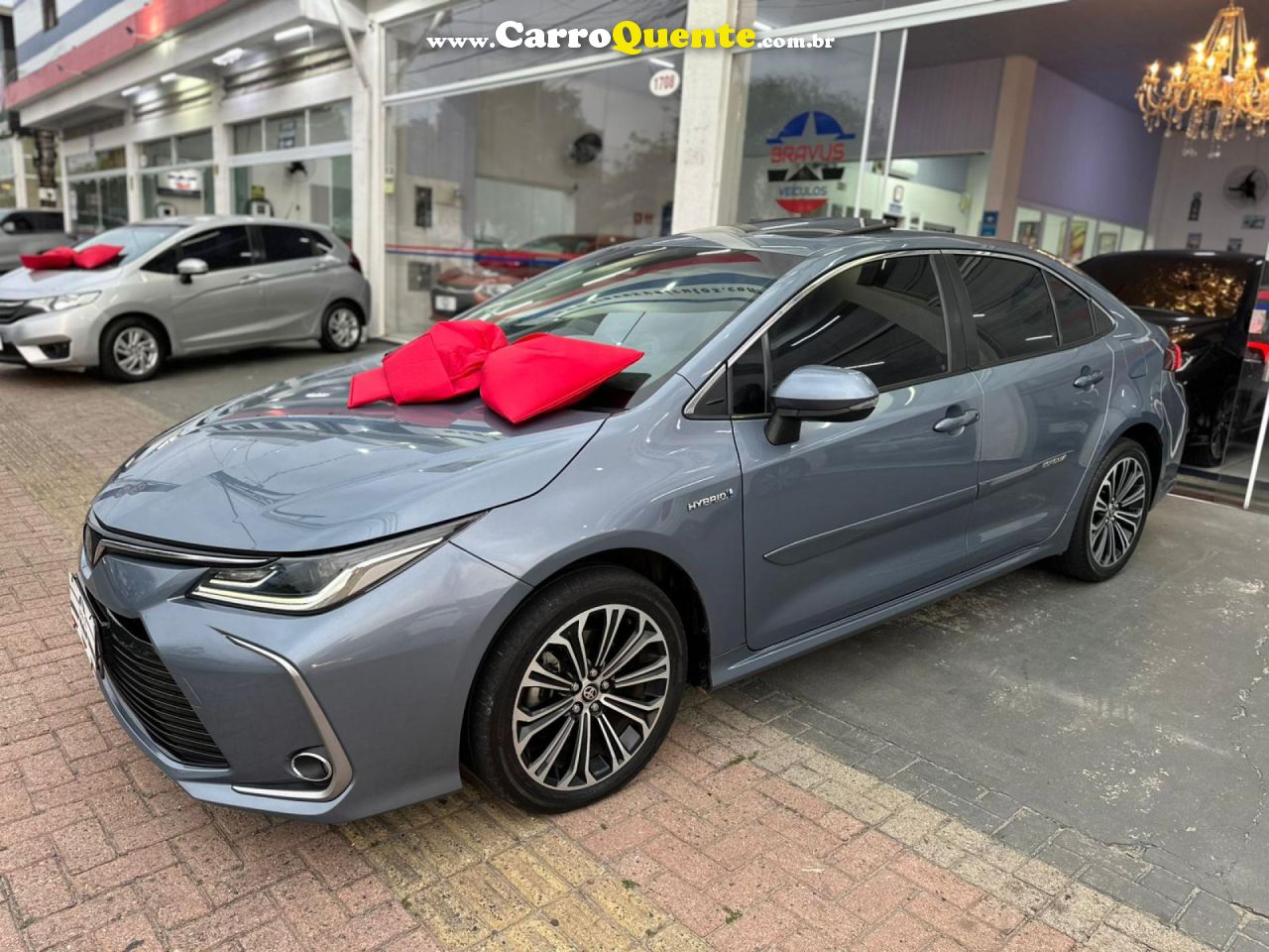 TOYOTA   COROLLA ALTIS PREM. 1.8 AUT. (HÍBRIDO)   CINZA 2020 1.8 FLEX E ELÉTRICO - Loja