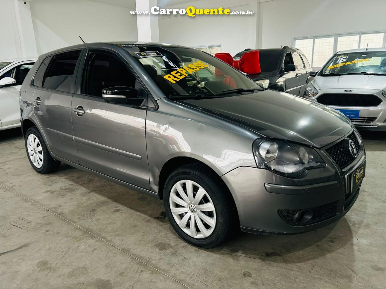 VOLKSWAGEN   POLO 1.6 MIS.OURO 1.6 MI TOT.FLEX 8V 5P   CINZA 2011 1.6 GASOLINA - Loja