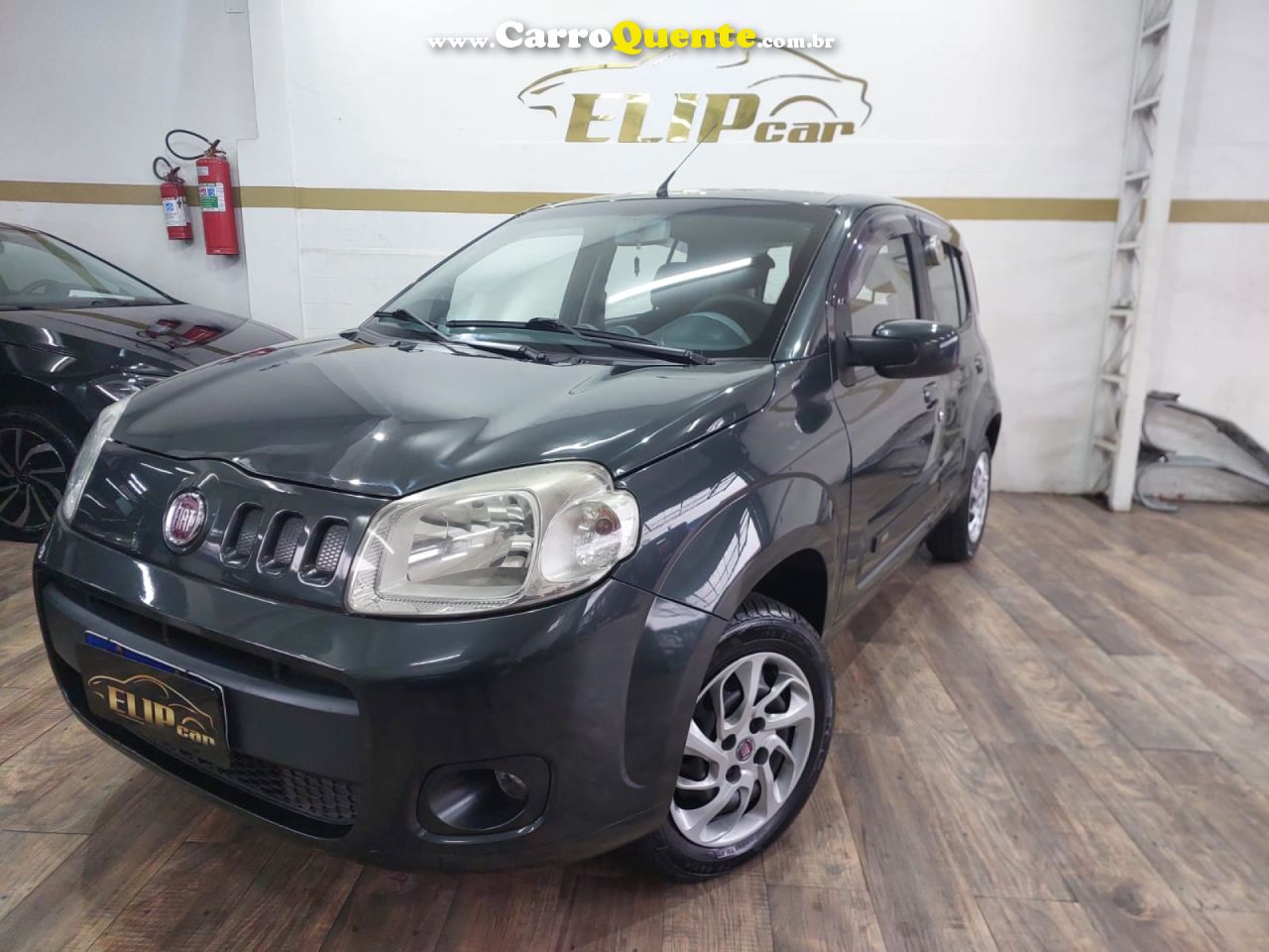 FIAT   UNO ECONOMY CELEB. 1.4 EVO F. FLEX 8V 4P   CINZA 2013 1.4 FLEX - Loja