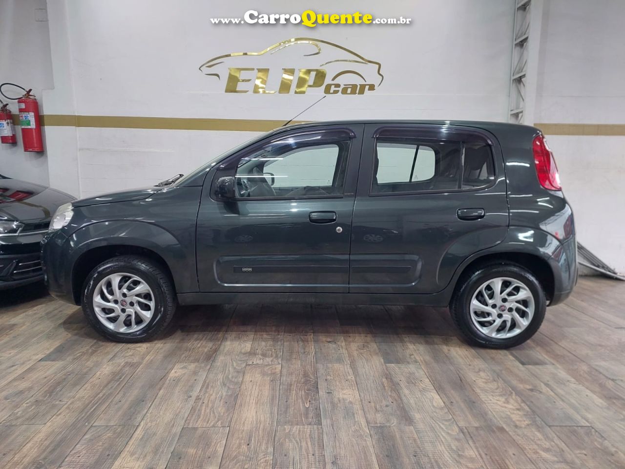 FIAT   UNO ECONOMY CELEB. 1.4 EVO F. FLEX 8V 4P   CINZA 2013 1.4 FLEX - Loja