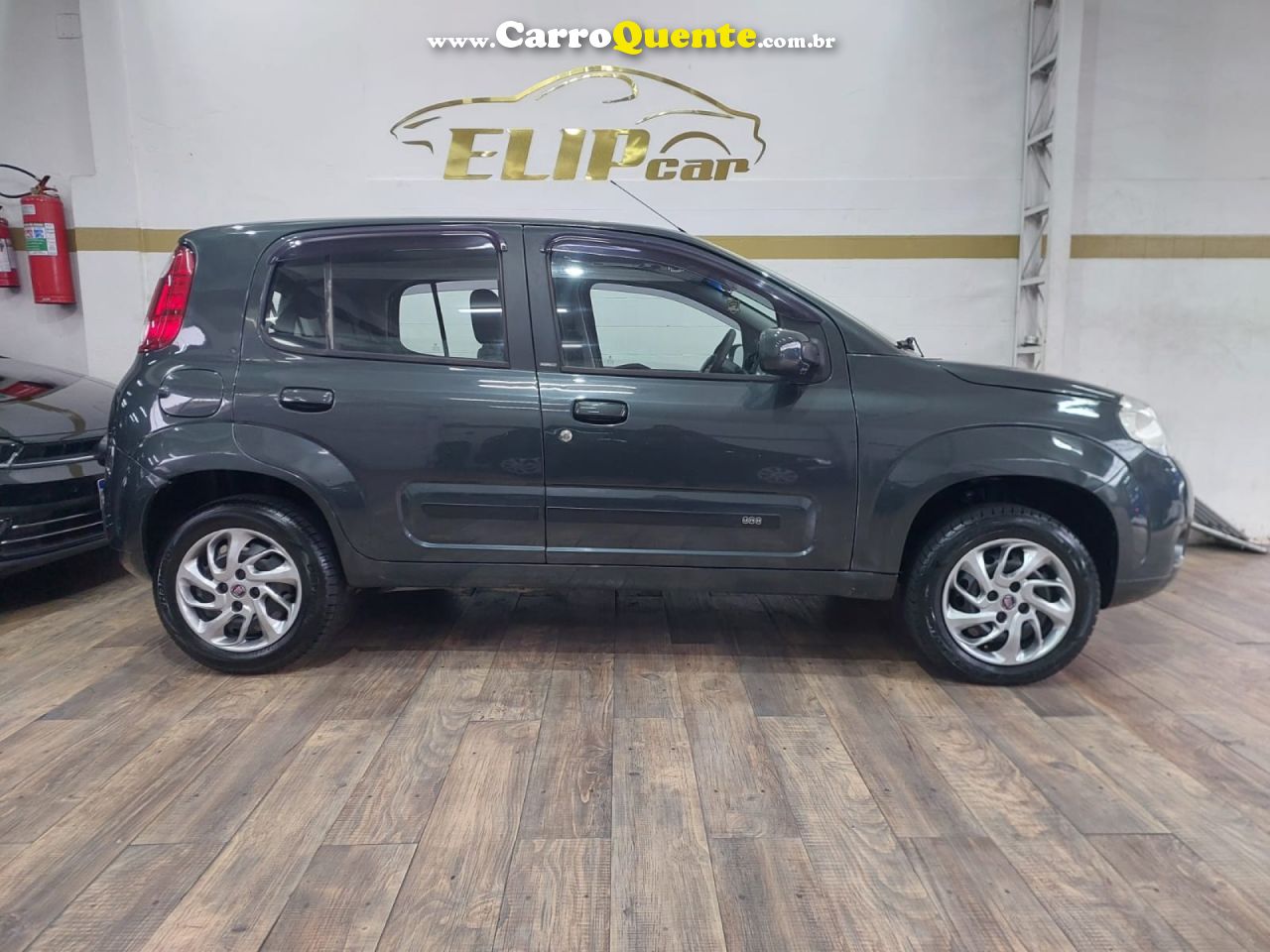 FIAT   UNO ECONOMY CELEB. 1.4 EVO F. FLEX 8V 4P   CINZA 2013 1.4 FLEX - Loja