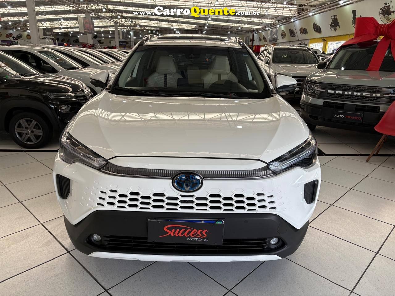 COROLLA CROSS 1.8 VVT-I HYBRID FLEX XRX CVT C/ TETO SOLAR 2026 - Loja