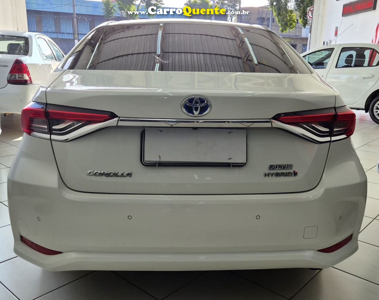 TOYOTA   COROLLA ALTIS PREM. 1.8 AUT. (HÍBRIDO)   BRANCO 2024 1.8 FLEX - Loja