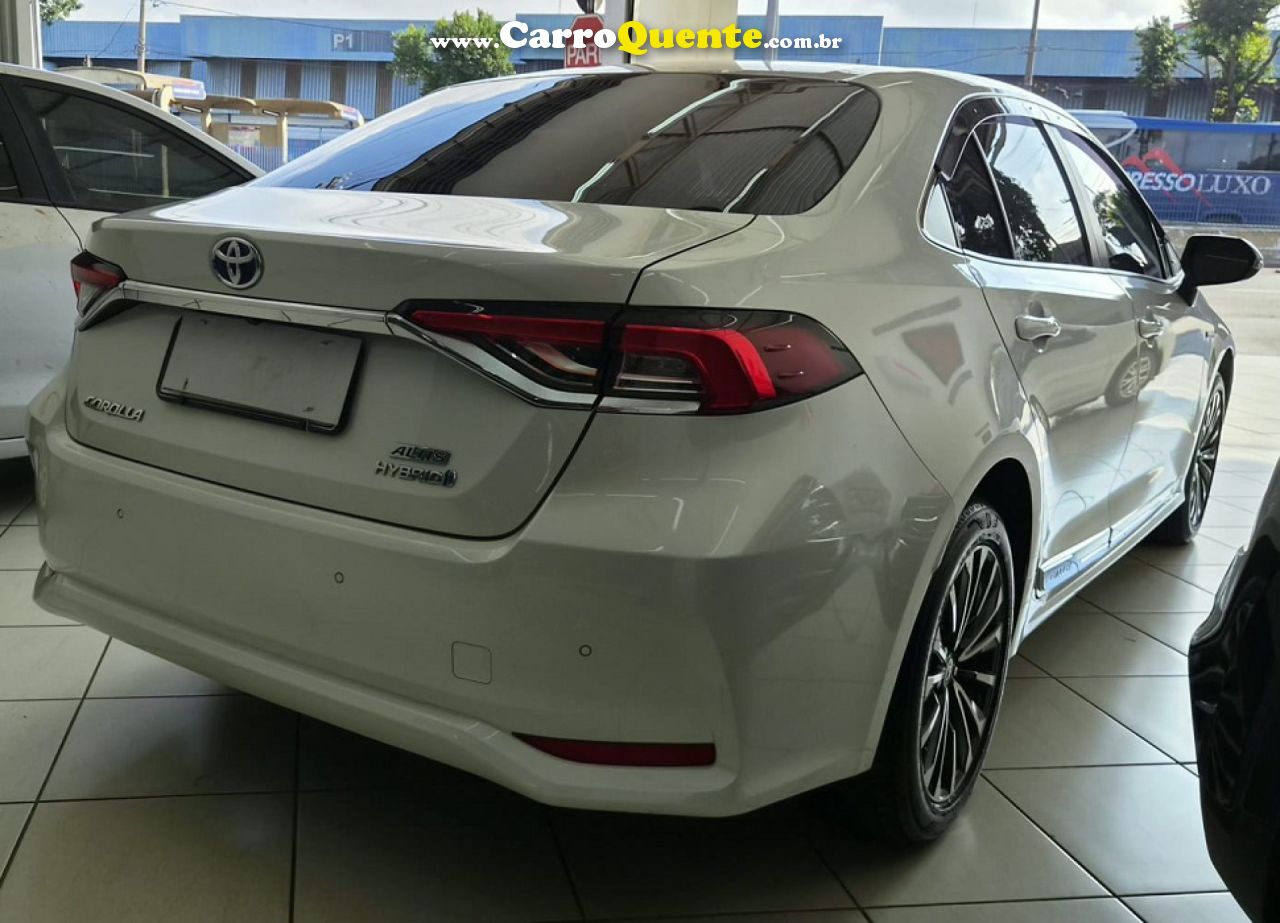 TOYOTA   COROLLA ALTIS PREM. 1.8 AUT. (HÍBRIDO)   BRANCO 2024 1.8 FLEX - Loja