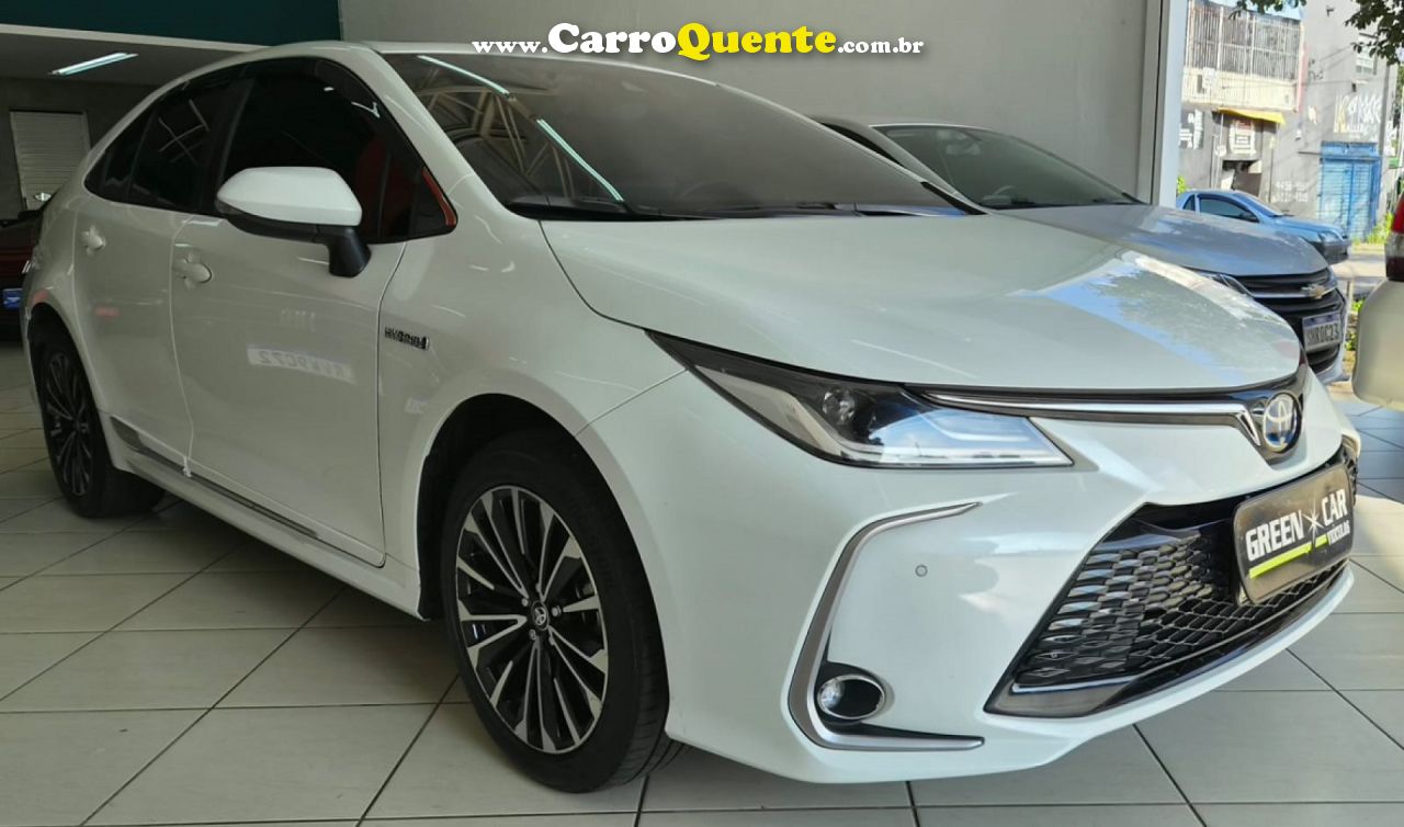 TOYOTA   COROLLA ALTIS PREM. 1.8 AUT. (HÍBRIDO)   BRANCO 2024 1.8 FLEX - Loja