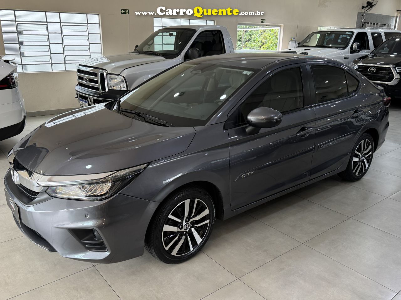 HONDA   CITY SEDAN TOURING 1.5 FLEX 16V 4P AUT.   CINZA 2022 1.5 FLEX - Loja