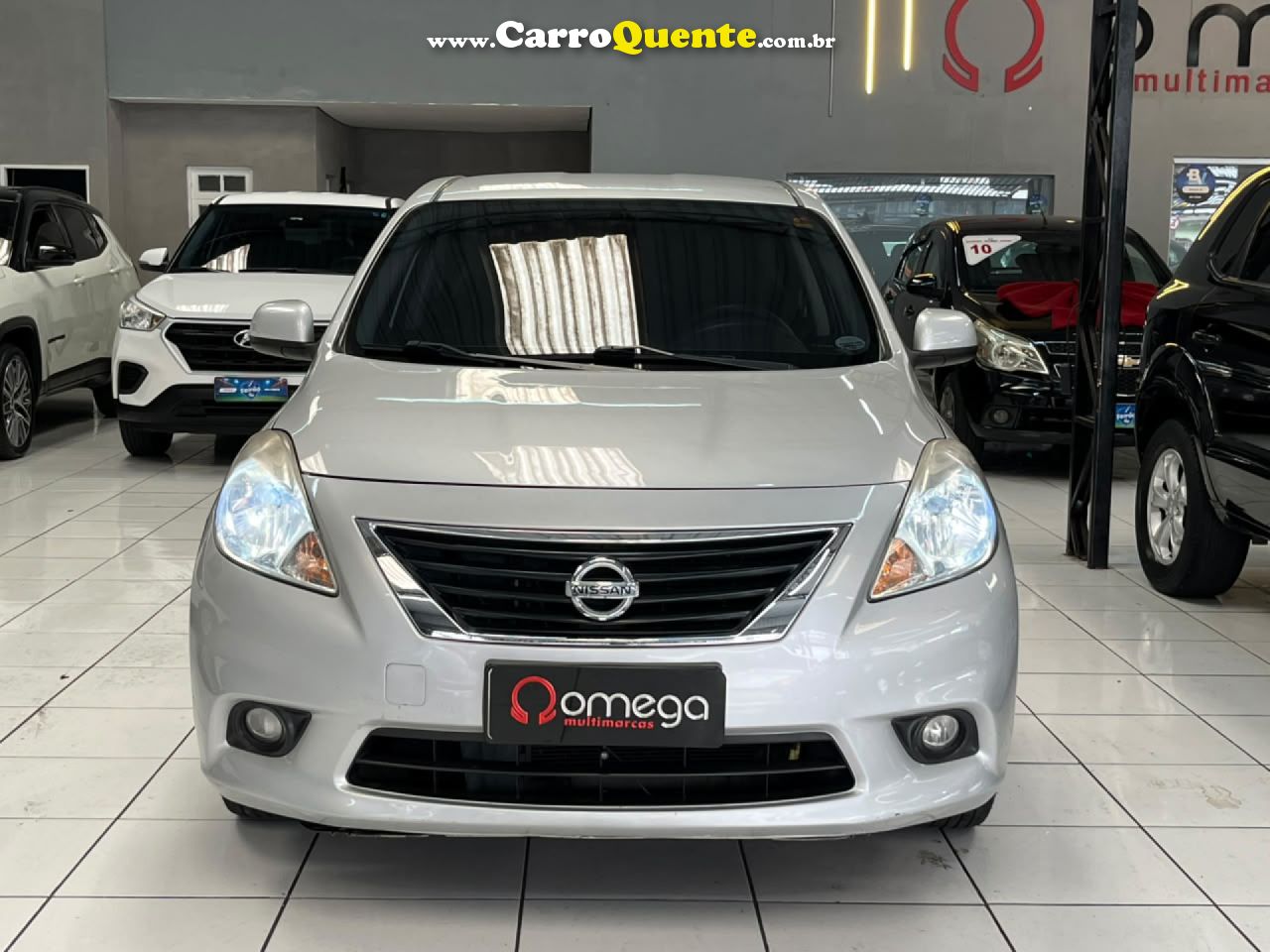 NISSAN   VERSA SL 1.6 16V FLEX FUEL 4P MEC.   PRATA 2013 1.6 FLEX - Loja