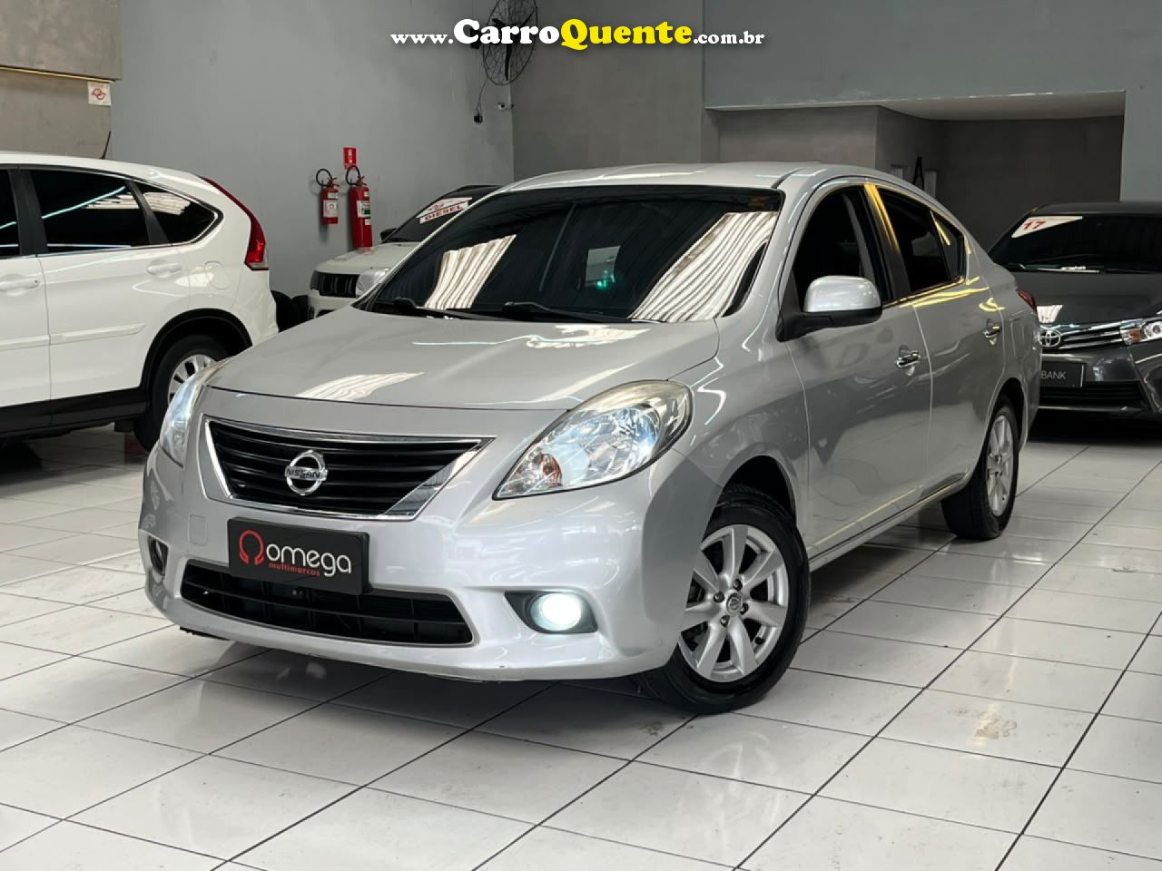 NISSAN   VERSA SL 1.6 16V FLEX FUEL 4P MEC.   PRATA 2013 1.6 FLEX - Loja