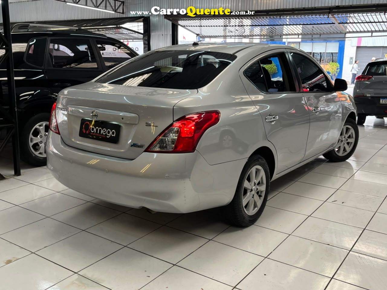 NISSAN   VERSA SL 1.6 16V FLEX FUEL 4P MEC.   PRATA 2013 1.6 FLEX - Loja