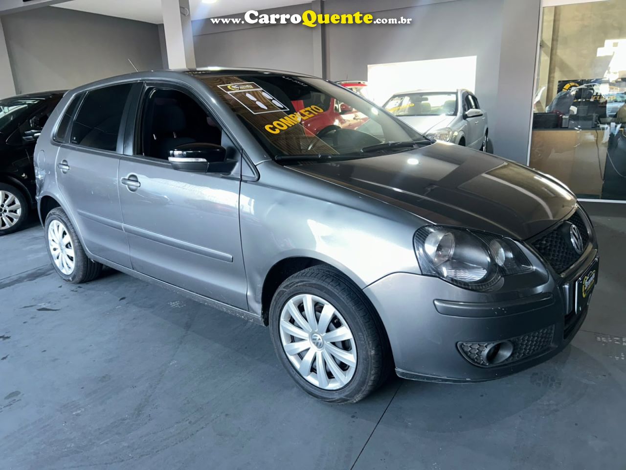 VOLKSWAGEN   POLO 1.6 MIS.OURO 1.6 MI TOT.FLEX 8V 5P   CINZA 2011 1.6 GASOLINA - Loja