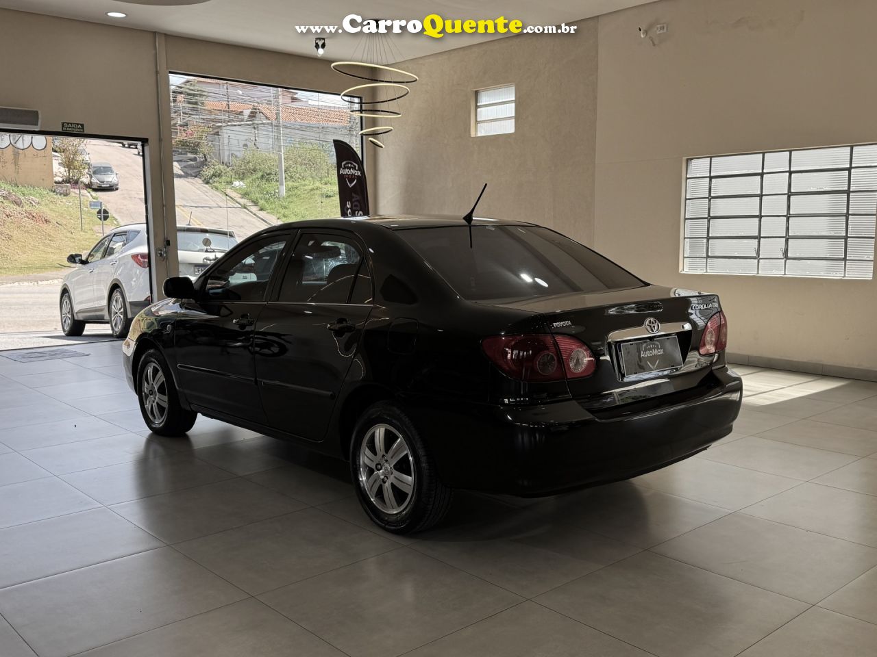 TOYOTA   COROLLA SE-G 1.81.8 FLEX 16V AUT.   PRETO 2006 1.8 GASOLINA - Loja
